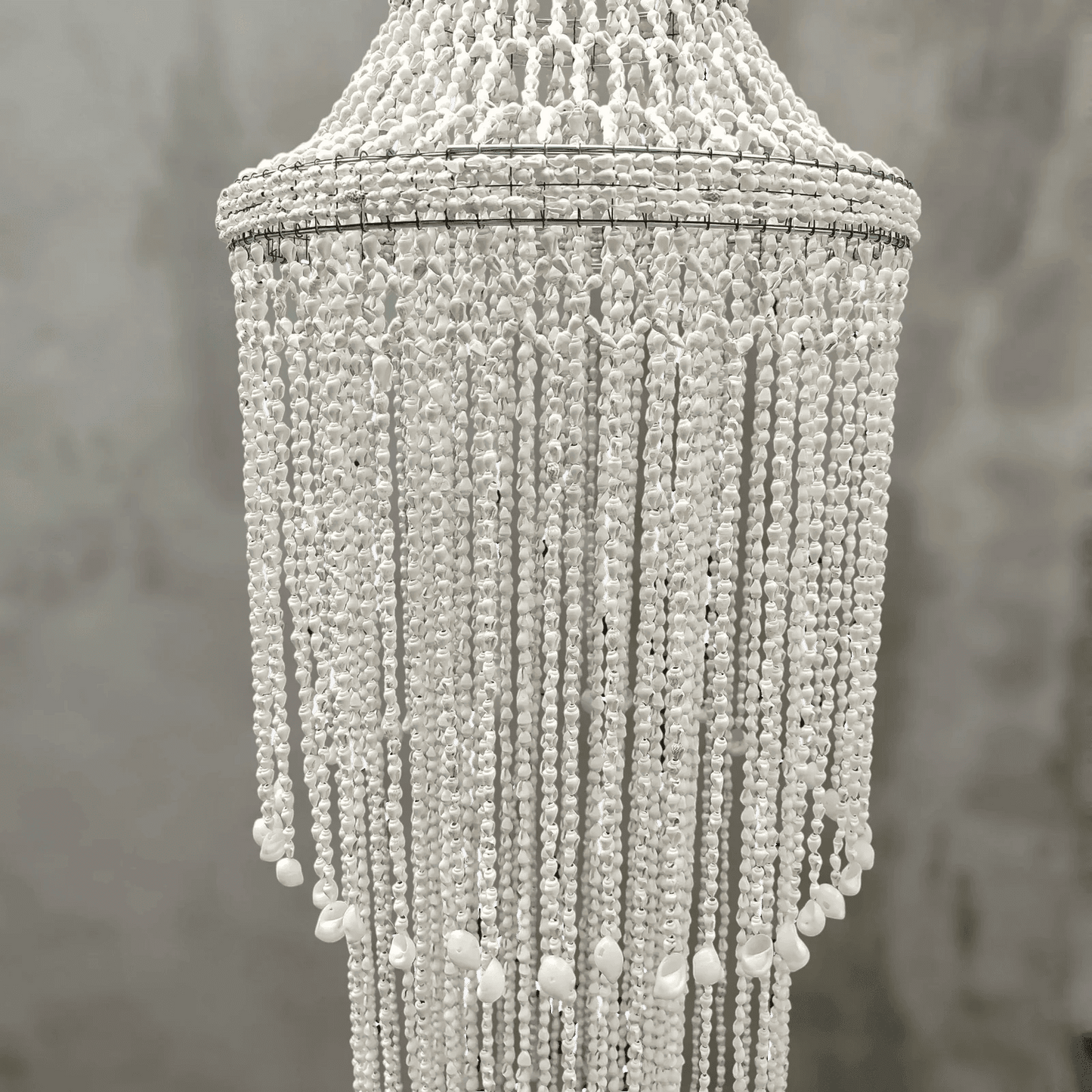 Seashell chandelier against a neutral background