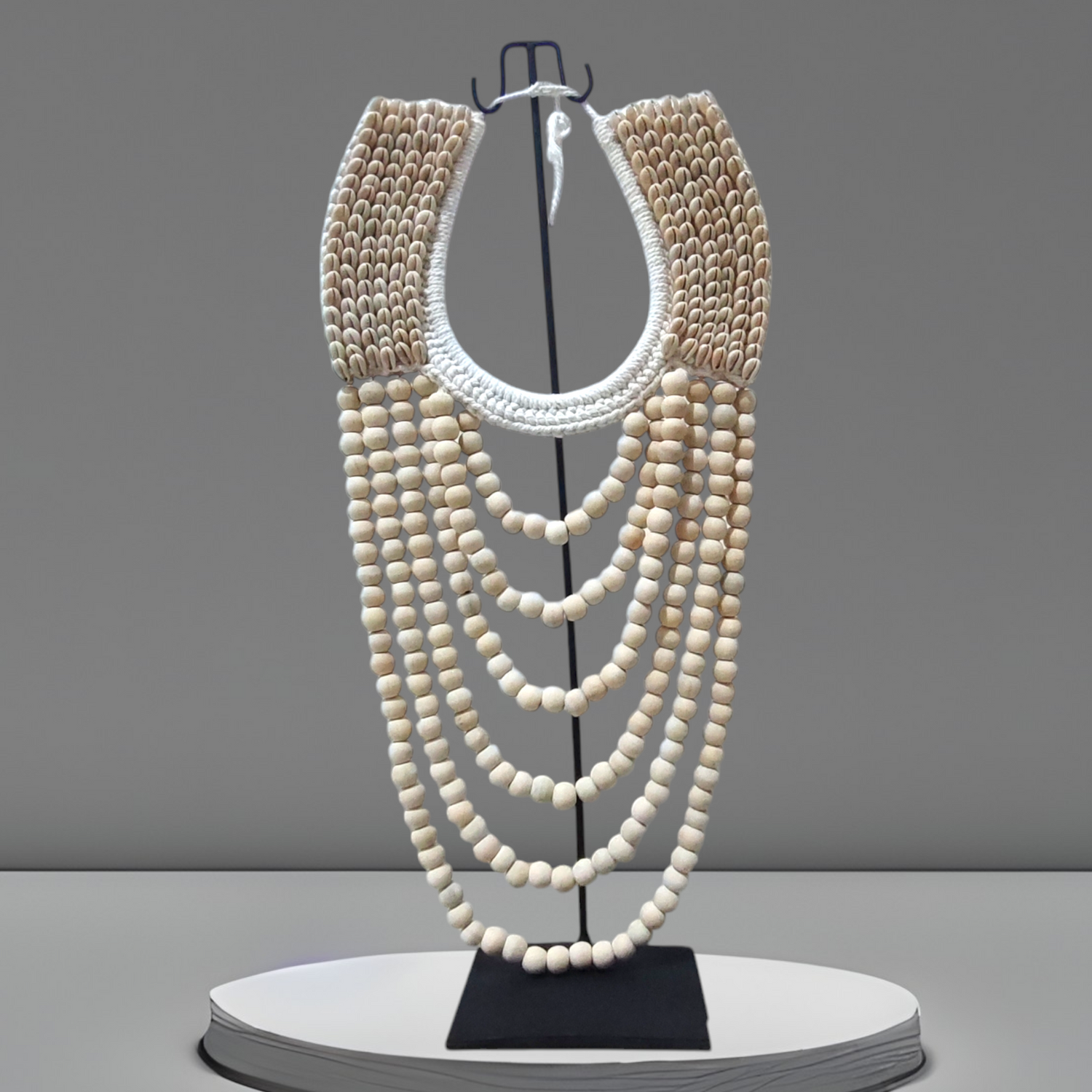 natural color papua necklace on black stand from kalamartshop