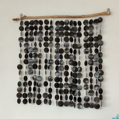 Wall art made of black capiz shell on a white background