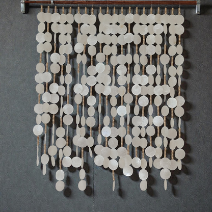 Capiz shell wall hanging decor hanging on grey wall