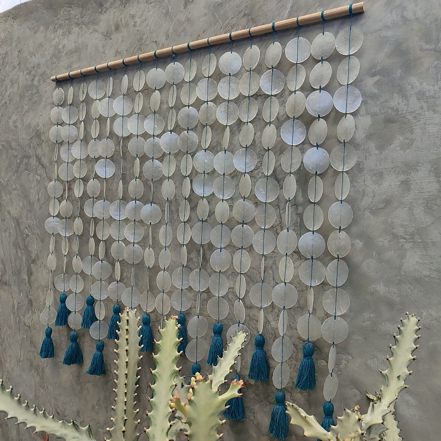 Capiz wall hanging with blue cotton tassel for Boho Interior Decor