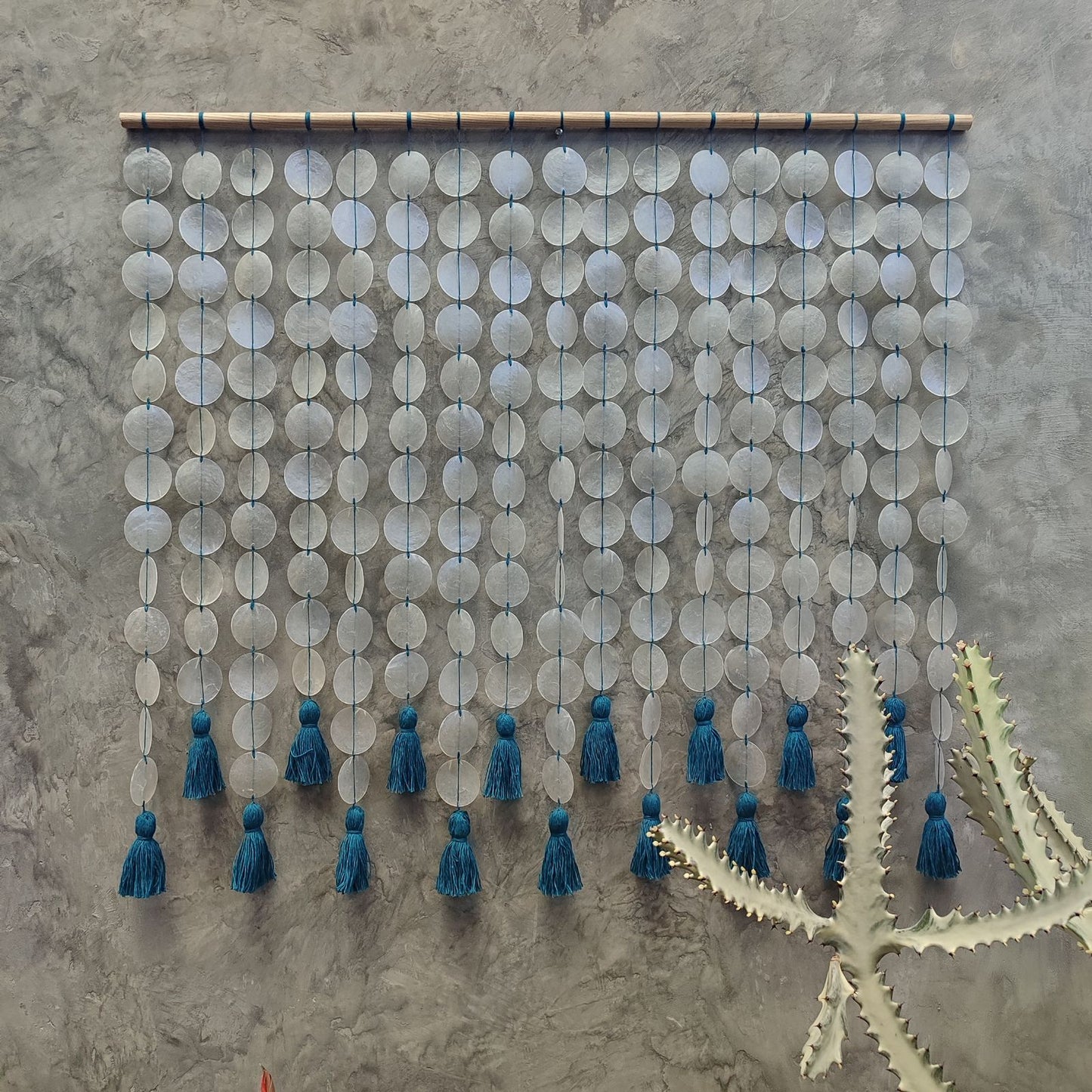 Capiz wall hanging with blue cotton tassel for Boho Interior Decor