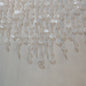 Close-up of a textured wall with hanging beads or similar objects.