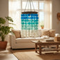Living room with a modern chandelier, sofa, coffee table, and decorative items.