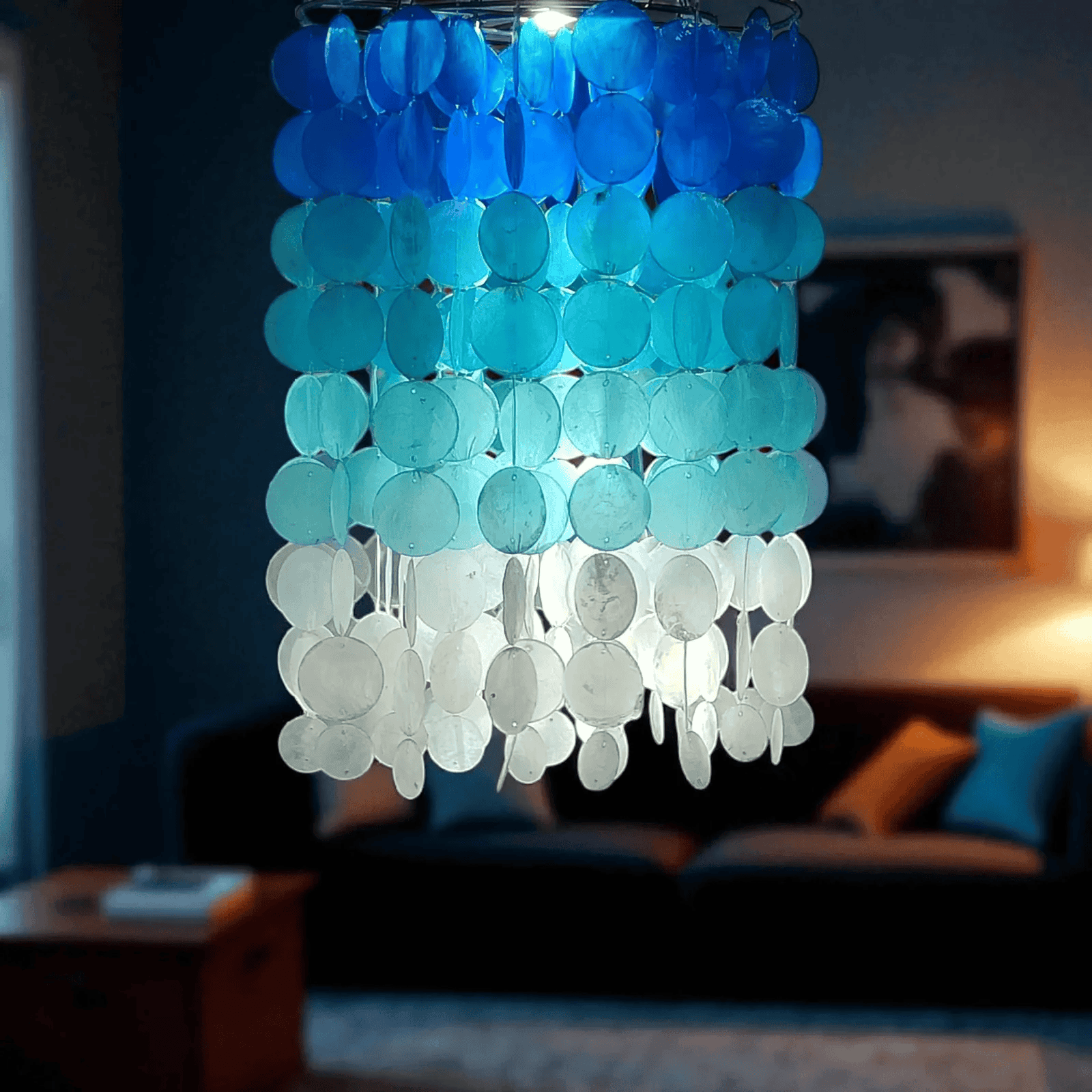 Decorative chandelier with blue and white circular capiz shell in a living room setting.