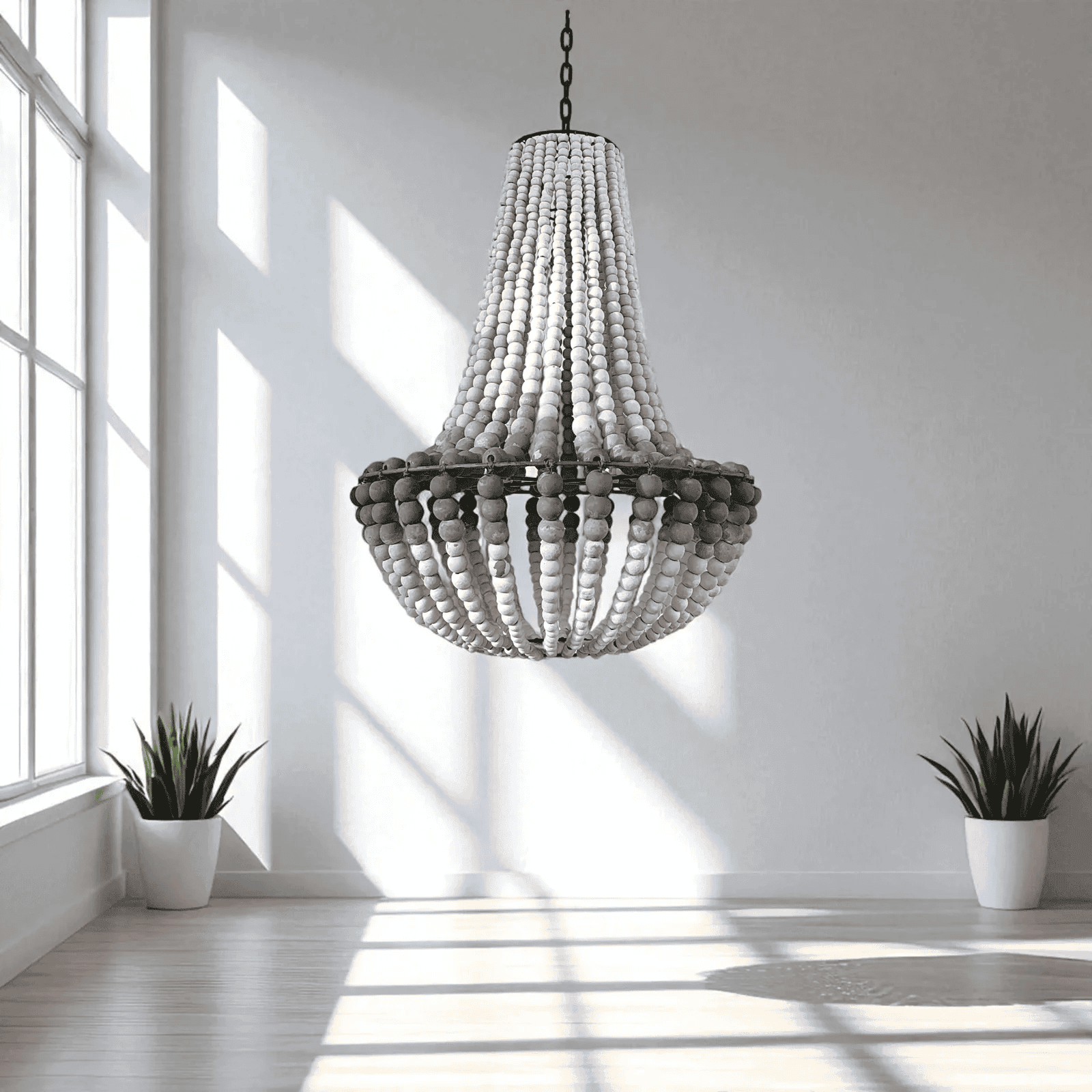 Wooden beaded chandelier hanging in a bright room with two potted plants.