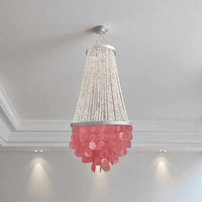 Chandelier with pink lower section and beige upper section hanging from a ceiling.