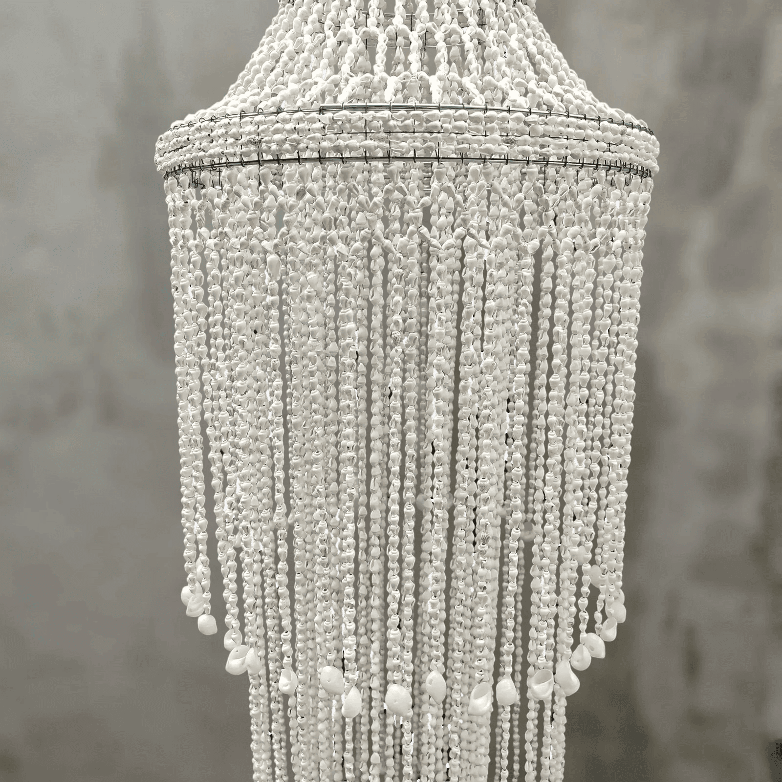 Seashell chandelier against a neutral background