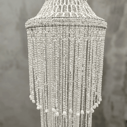 Seashell chandelier against a neutral background