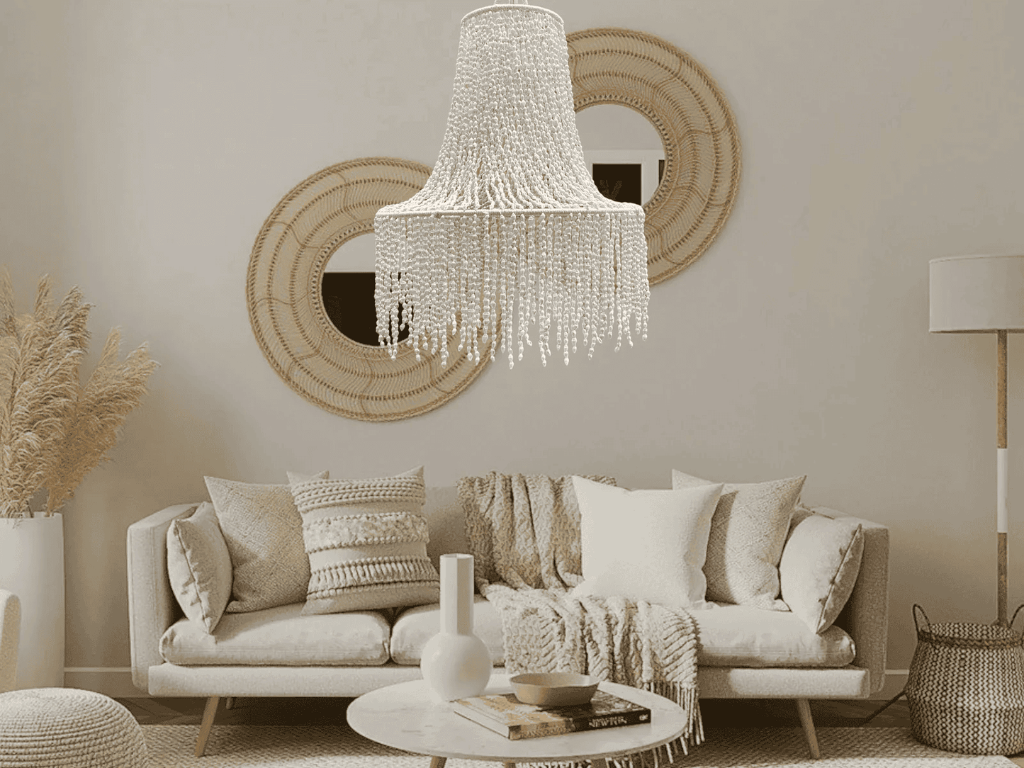 Living room with a seashell chandelier, sofa, and decorative elements.